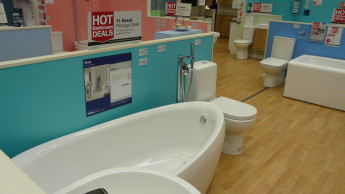 Wickes saves personnel and loses nearly six per cent