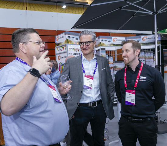 Summit means networking: Werner de Jager (right), CEO of Cashbuild in South Africa, talking to sponsors.