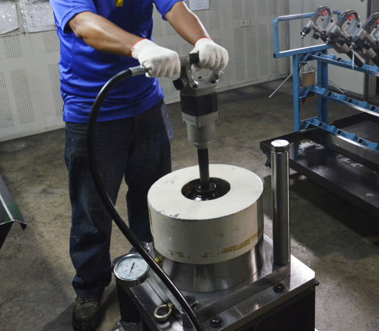 A pneumatic tool undergoes final torque testing. A pneumatic tool undergoes final torque testing.