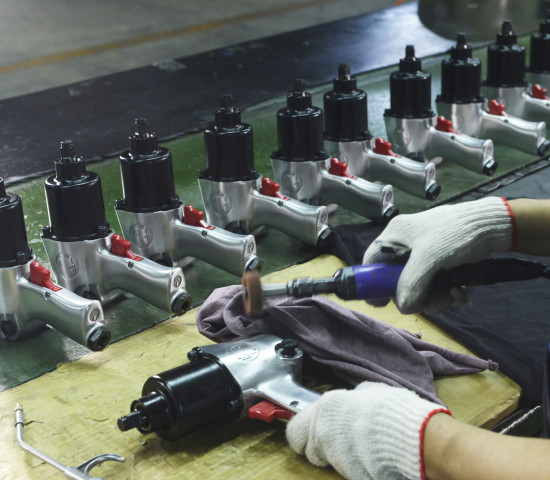 Pneumatic impact wrenches receive their final surface finish. Pneumatic impact wrenches receive their final surface finish.